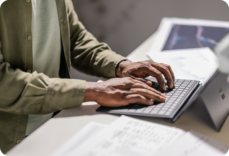 Person typing on laptop